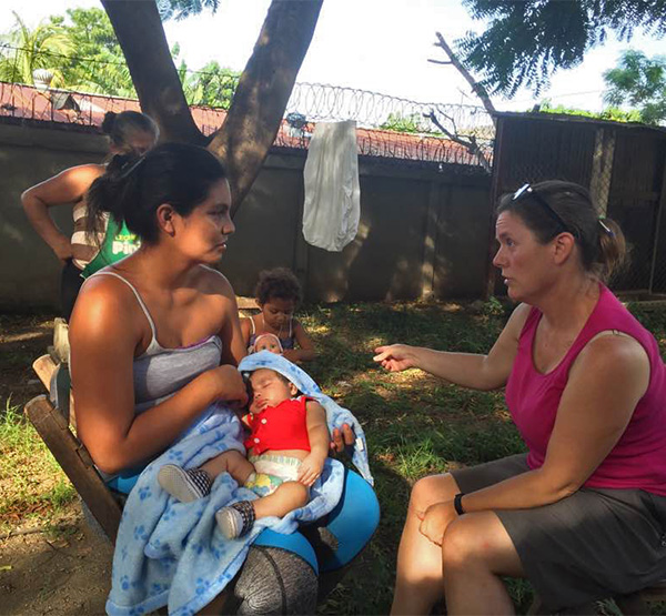 Jennifer Aist working with a mother and baby at a village clinic in Nicaragua.